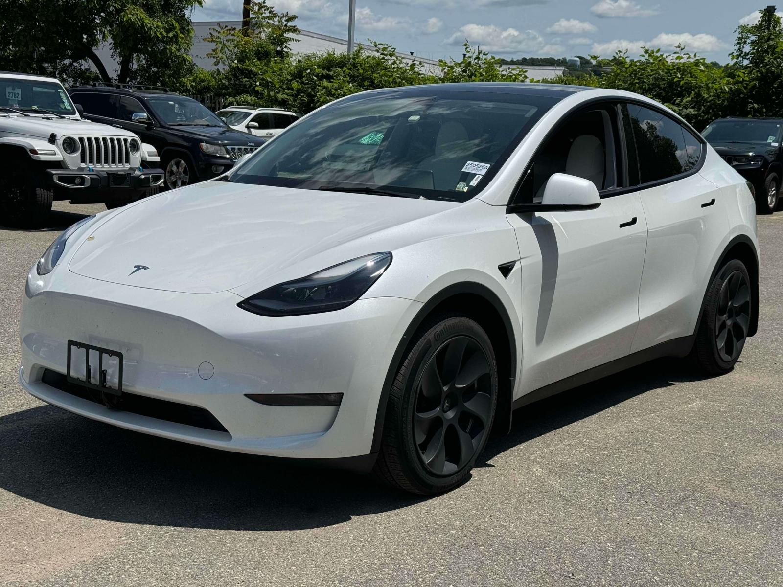 Used 2023 Tesla Model Y Long Range with VIN 7SAYGAEE9PF828572 for sale in Little Falls, NJ