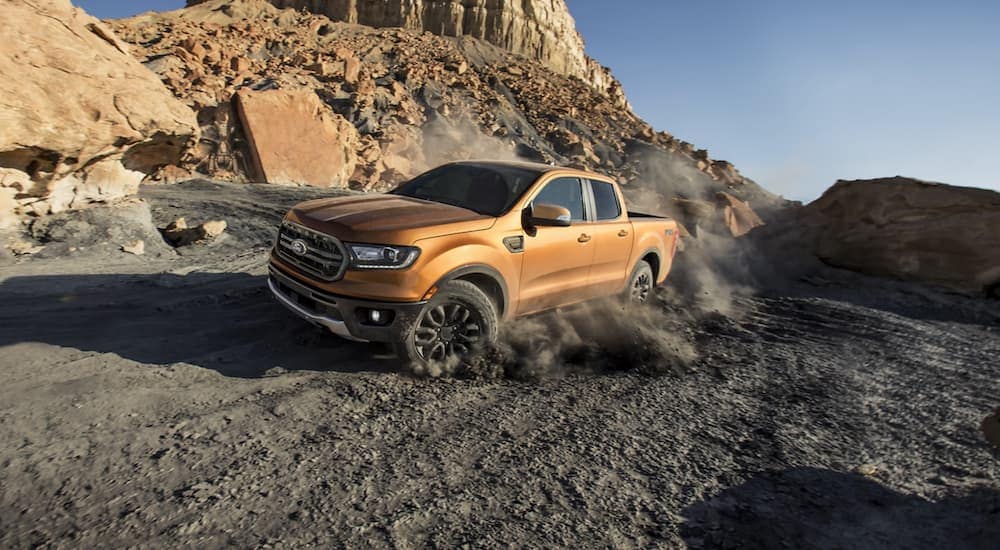 A gold 2020 Ford Ranger is shown from the front at an angle while off-road.