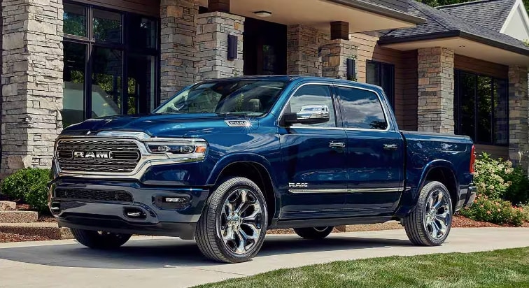 Blue Ram 1500 parked in front of home