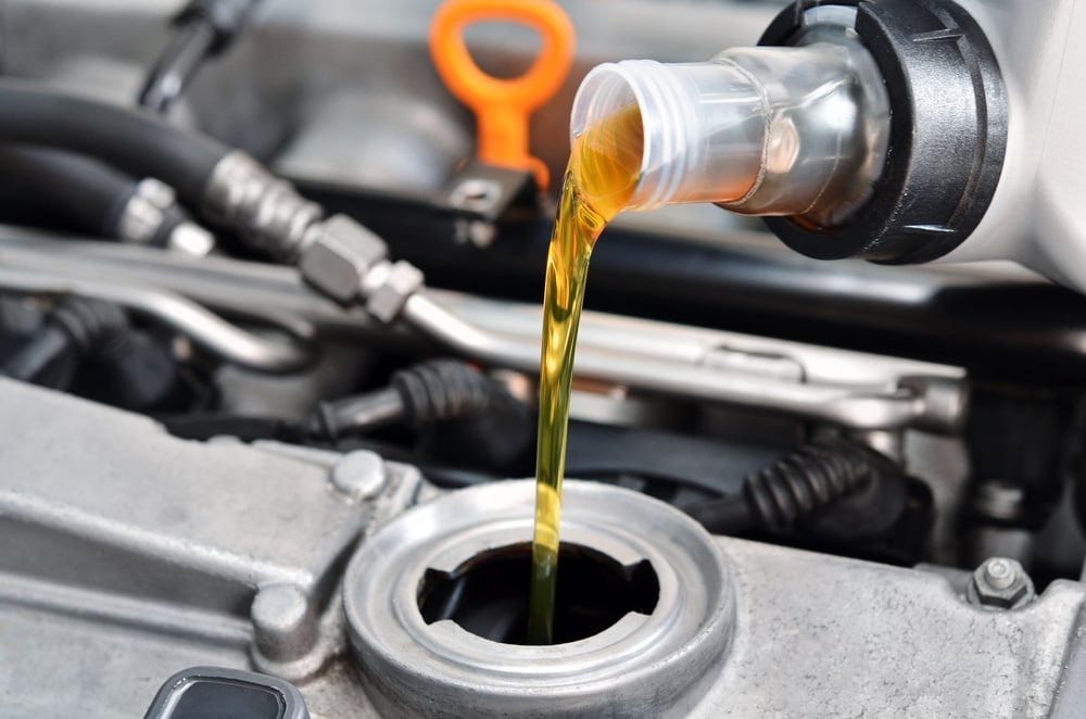 Pouring New Oil into Engine