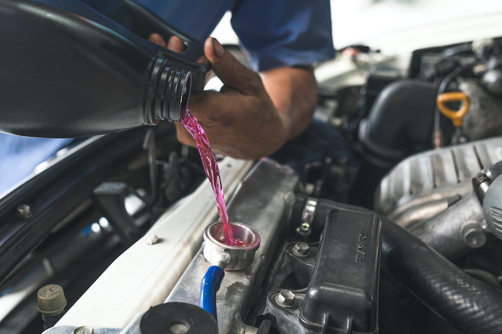 New Coolant Being Pouring in Funnel