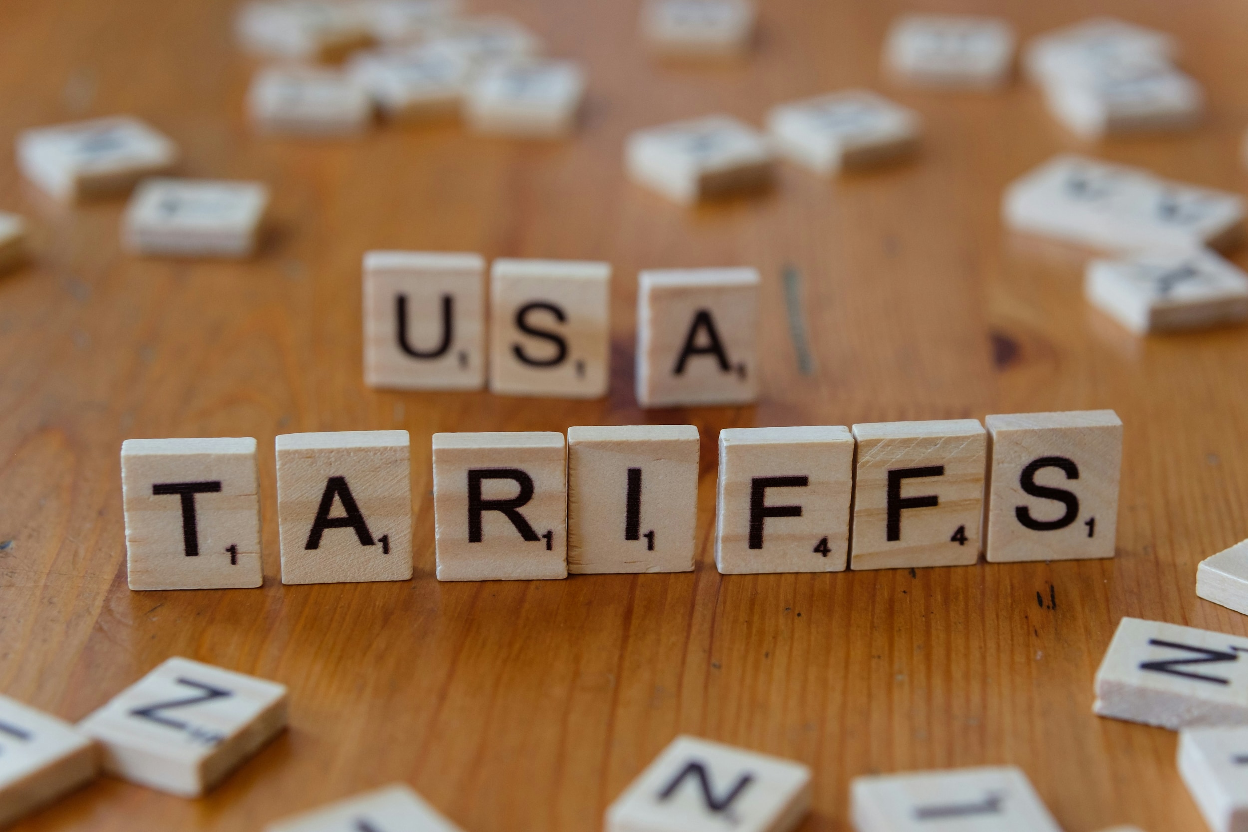 Scarbble tiles spelling out USA TARIFFS