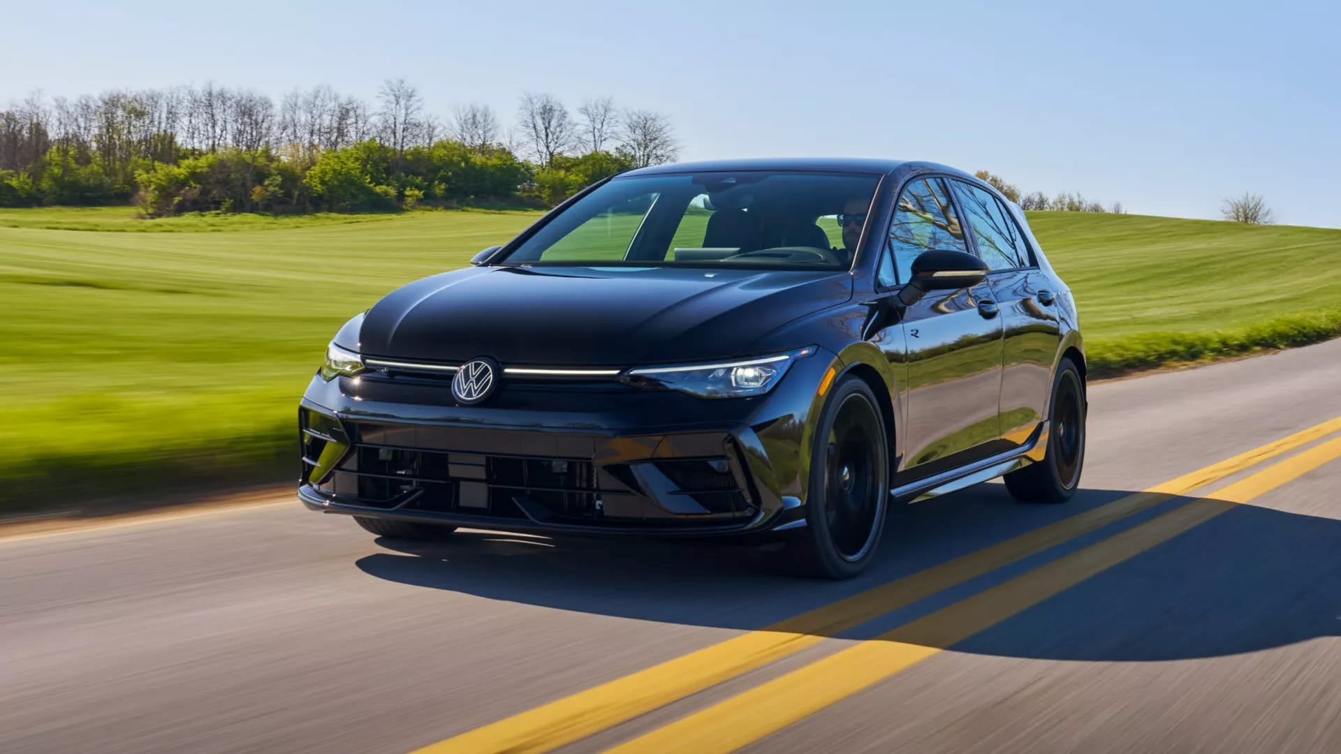 2025 Volkswagen Golf driving on the highway