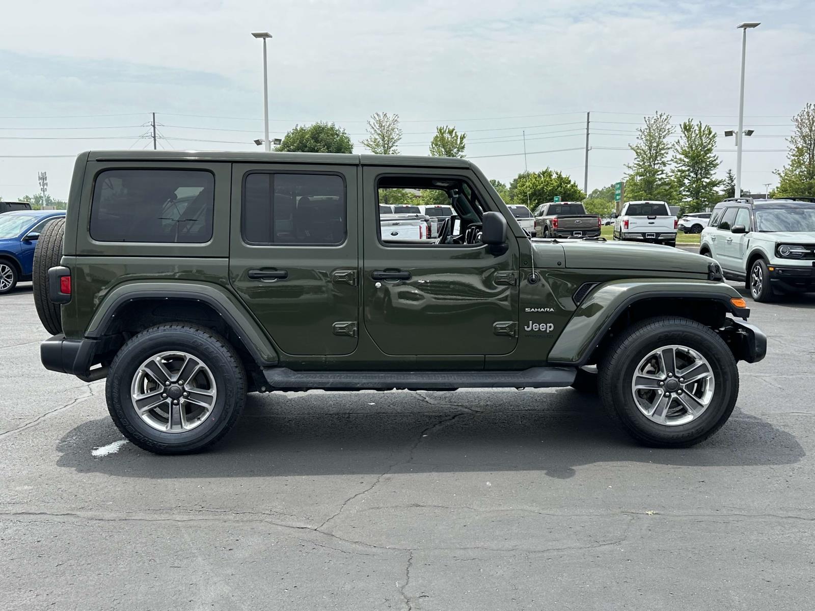 Used 2022 Jeep Wrangler Unlimited Sahara with VIN 1C4HJXEN1NW107561 for sale in Macomb, MI