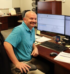 Staff member AJ Corlett from 3cb9d848ff0a