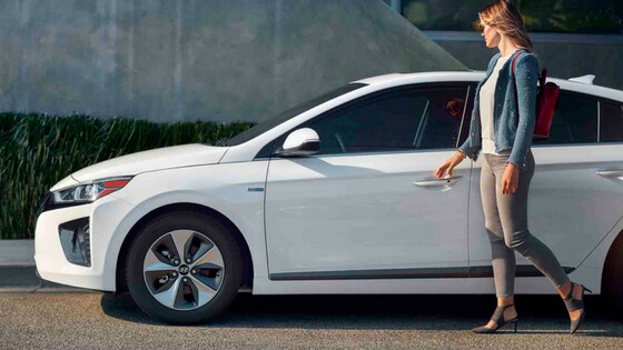 woman-walking-to-hyundai-car.png