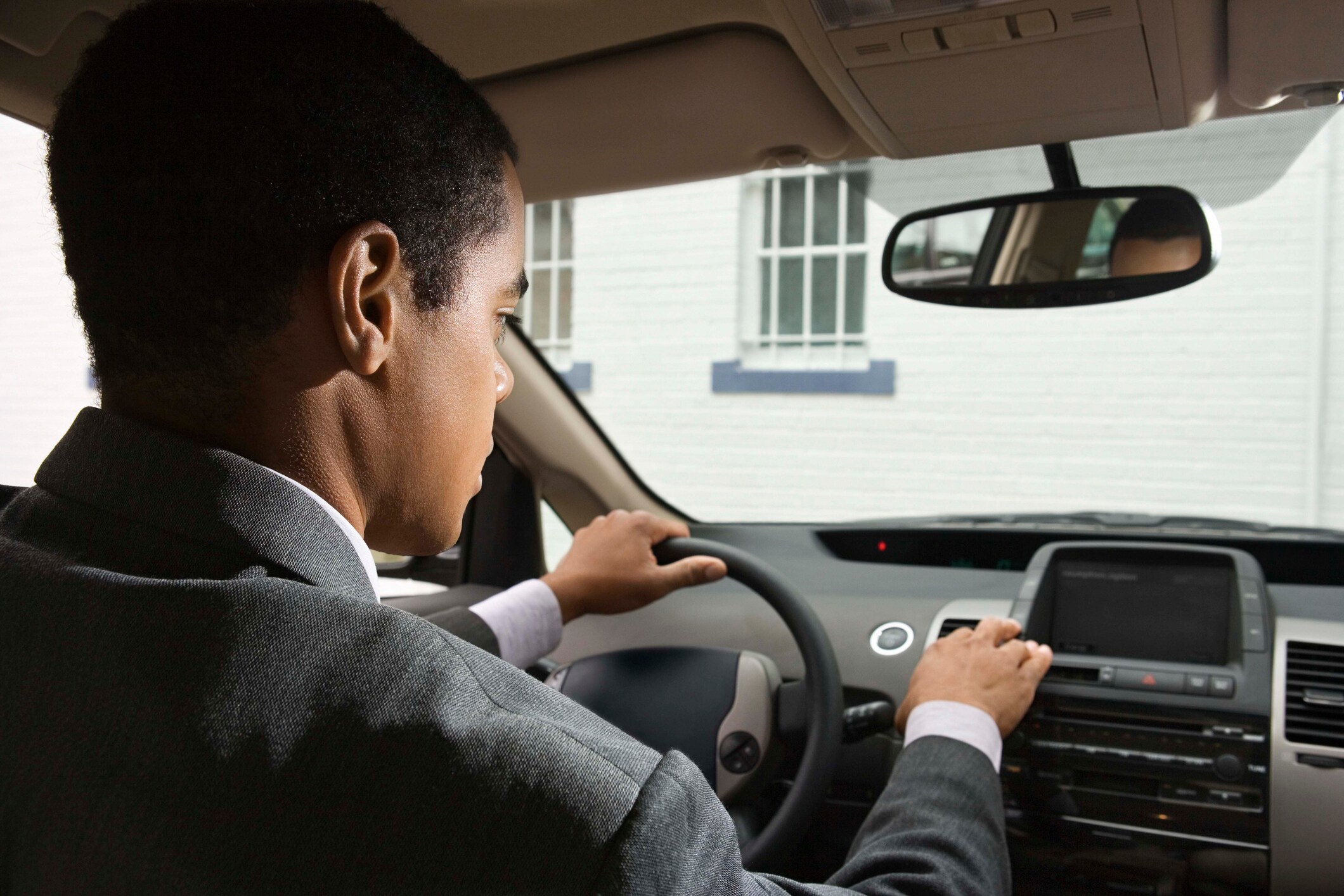 Man Driving Car with Blue Link
