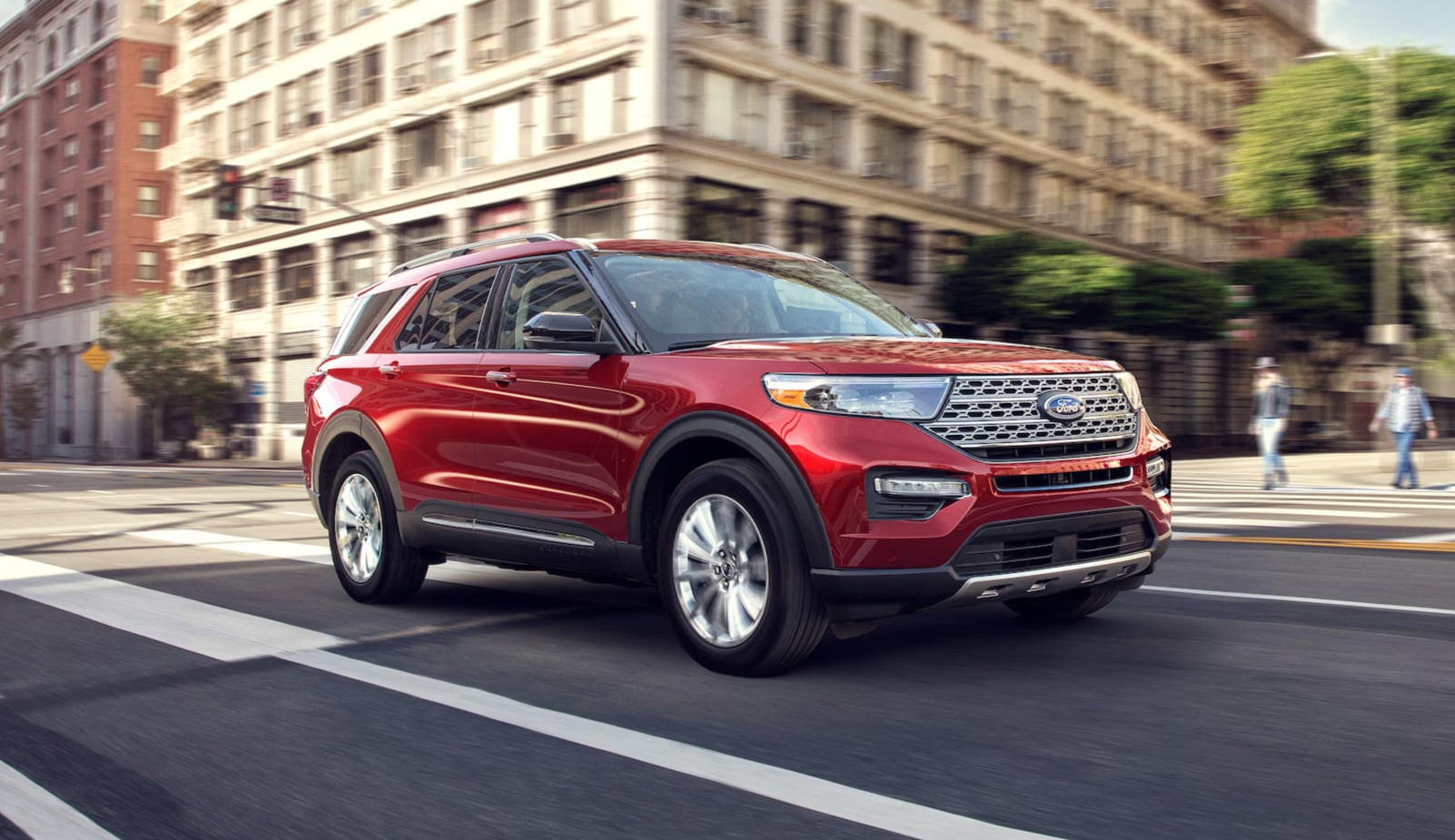 2024 Red Ford Explorer driving on street