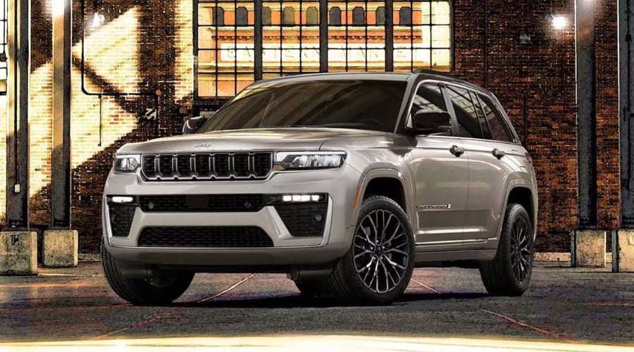Front profile picture of a 2026 Jeep Grand Cherokee parked inside Salerno Duane showroom showing off its refined luxury stance