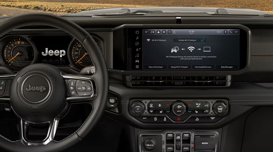 Dashboard digital display and Wi-Fi hotspot settings on the 2026 Jeep Wrangler infotainment touchscreen, highlighting connected tech features for commuters across Union County, NJ.