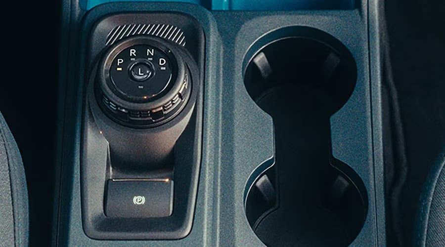 Overhead view of the 2026 Ford Maverick center console featuring the rotary gear shift dial and electronic parking brake, built for effortless gear shifts along Route 24 and I-78 in Union County.