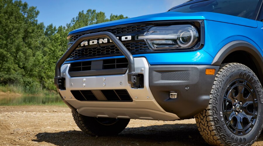 A side view of a 2026 Ford Bronco Sport driving through Morristown showcasing the sleek new styling updates