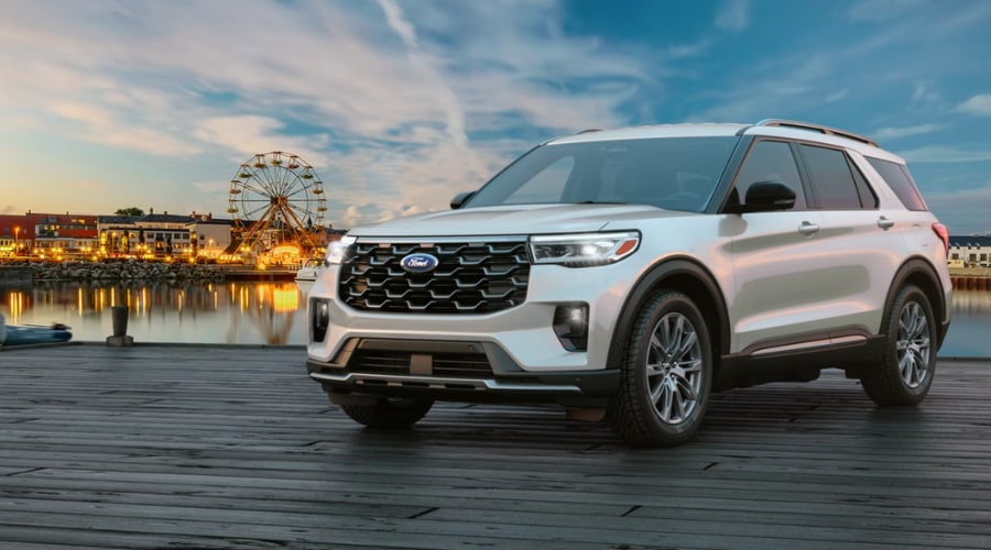 Front profile of a 2026 Ford Explorer parked on a scenic pier showing its bold grille design Salerno Duane Ford in Summit, NJ