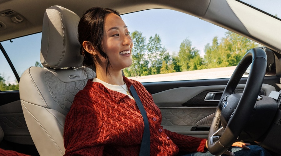 Smiling driver enjoying a relaxed, confident commute in a 2026 Ford Explorer Platinum equipped with calibrated Ford Co-Pilot360 safety features in Summit, NJ