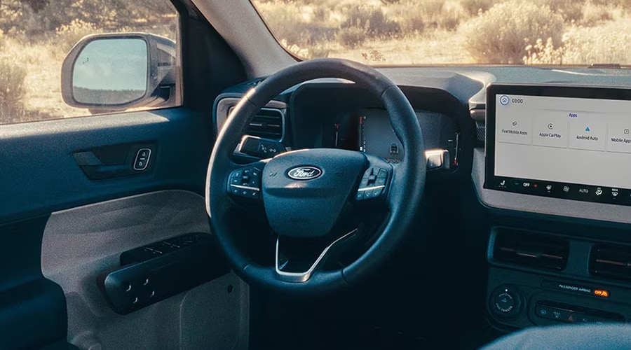 Driver cockpit view of the 2026 Ford Maverick featuring the SYNC 4 touchscreen display and multi-function steering wheel for daily commuters in Summit and Morristown, NJ.