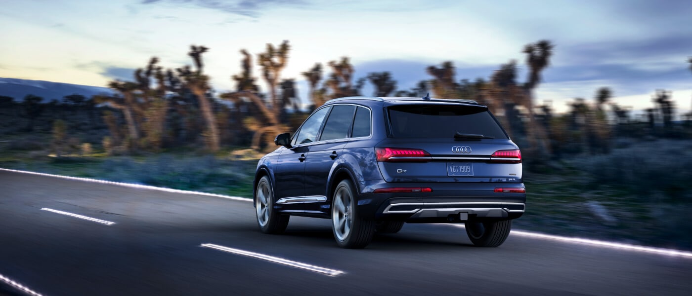 Blue 2020 Audi Q7 Rear View driving on a desert road