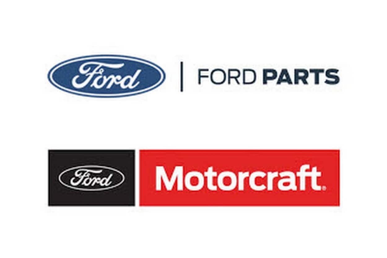 A display of Genuine Ford Motorcraft electrical parts including a battery and alternator.