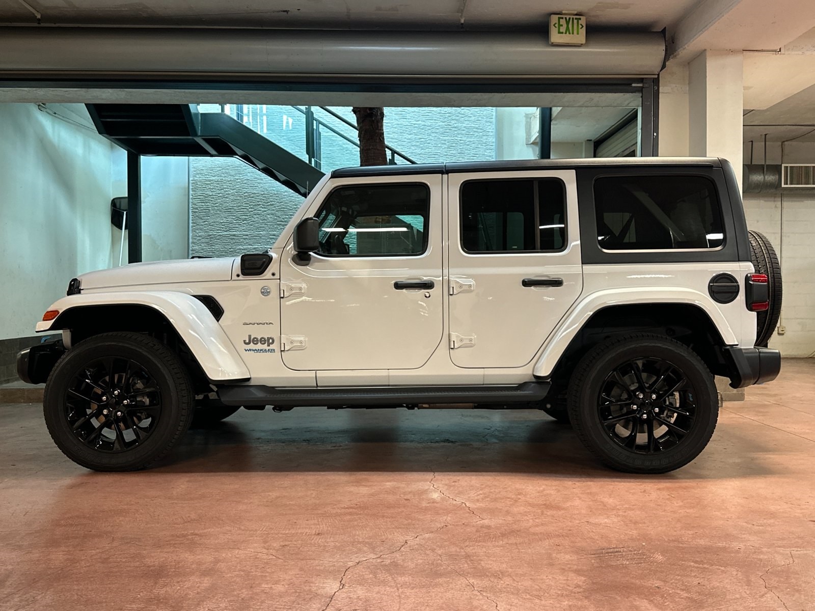 Certified 2022 Jeep Wrangler Unlimited Sahara 4XE with VIN 1C4JJXP69NW171449 for sale in Santa Monica, CA