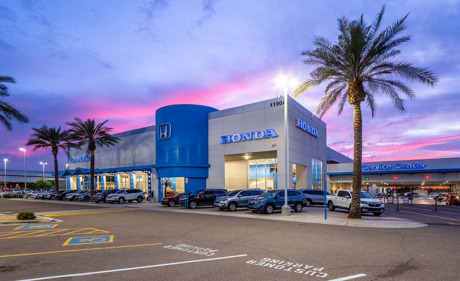 Exterior view of AutoNation Honda Chandler at sunset