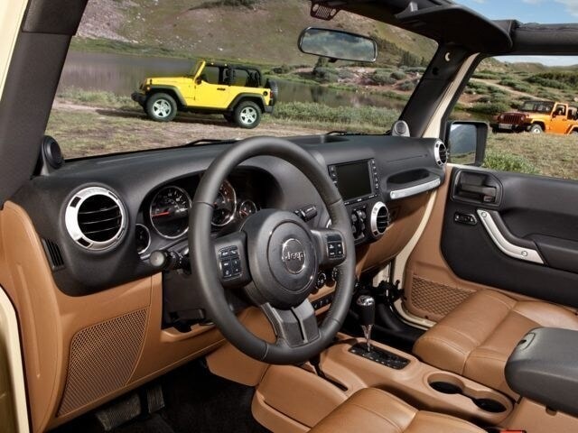 2014 Jeep Wrangler Unlimited dashboard and view of another Unlimited SUV.jpg