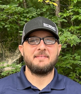 Staff member JUAN MANZOTTI from 5f67fc045e95