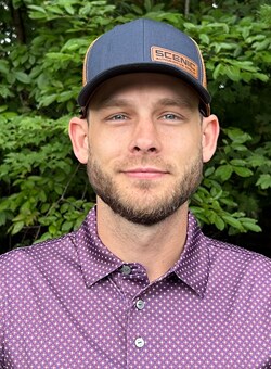 Staff member Travis Hunter from c8e12187f4e3