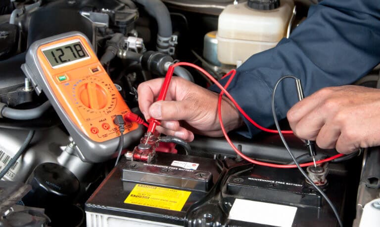 Service tech  checking health of battery