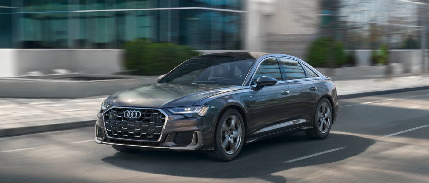 2025 Audi A6 Sedan exterior in front of office building