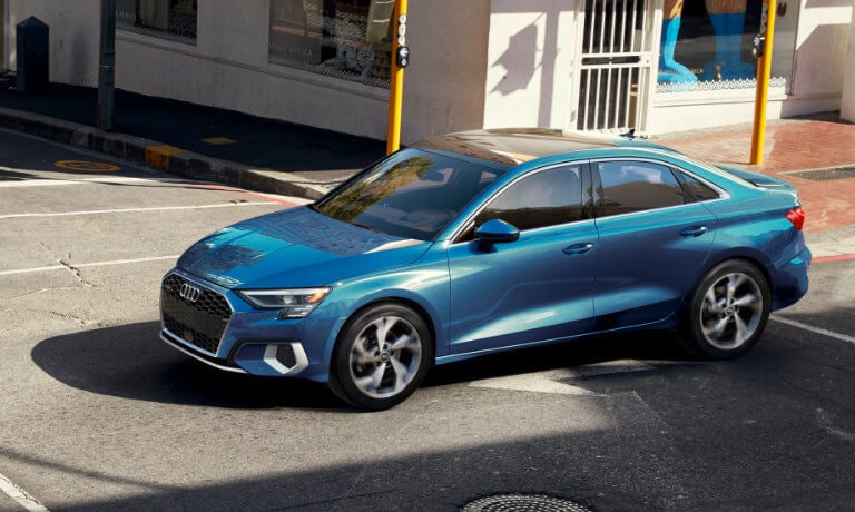 2022 Audi A3 exterior driving into city intersection