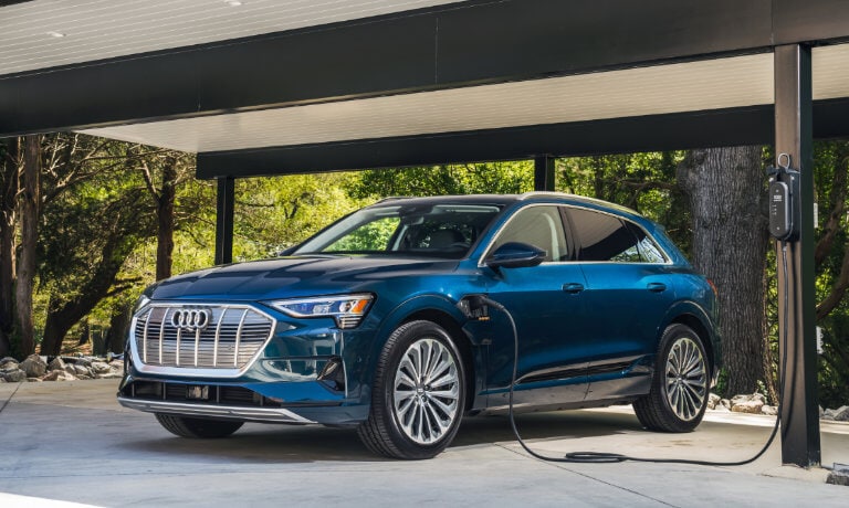 2023 Audi e-tron exterior charging in wooded garage
