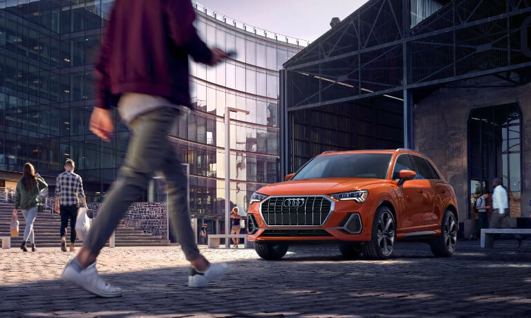 2021 Audi Q3 exterior parked downtown with people walking by