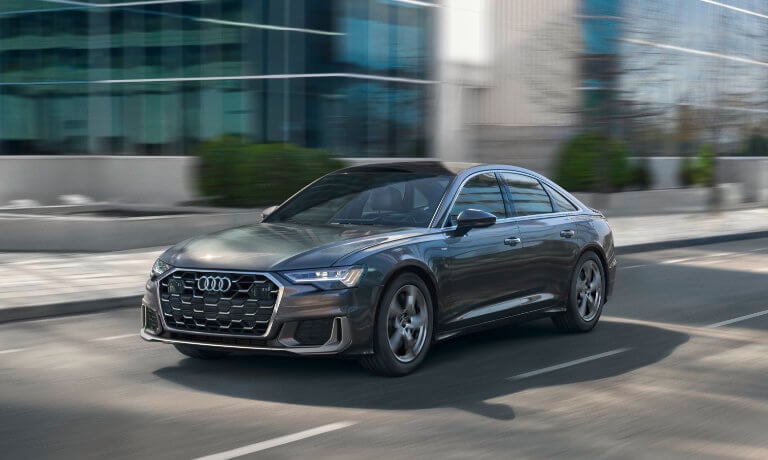 2025 Audi A6 Sedan exterior in front of office building