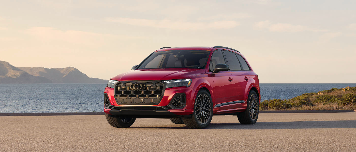 2025 Audi SQ7 exterior parked along mountain waterfront