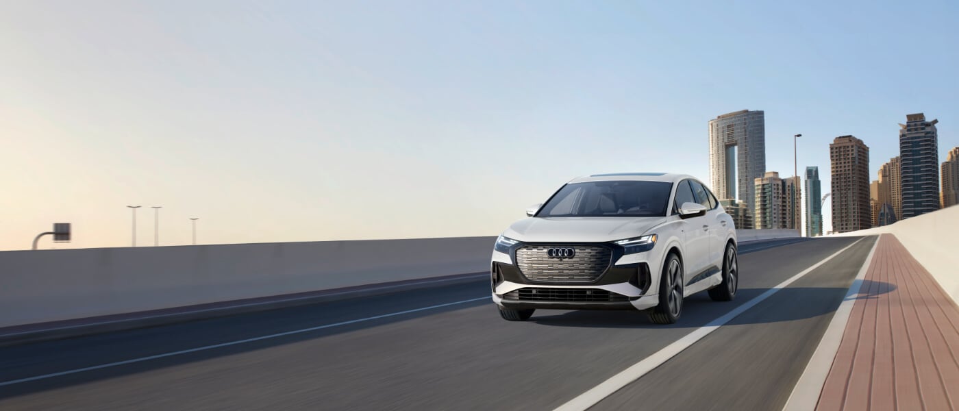 2025 Audi Q4 Sportback e-tron Exterior Driving Away From City