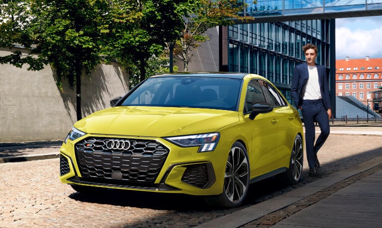 2024 Audi S3 exterior parked side of street with driver