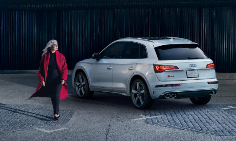 2022 Audi SQ5 exterior woman walking away from vehicle