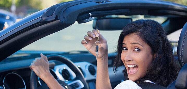 woman-driving-new-used-car-718x344.jpg
