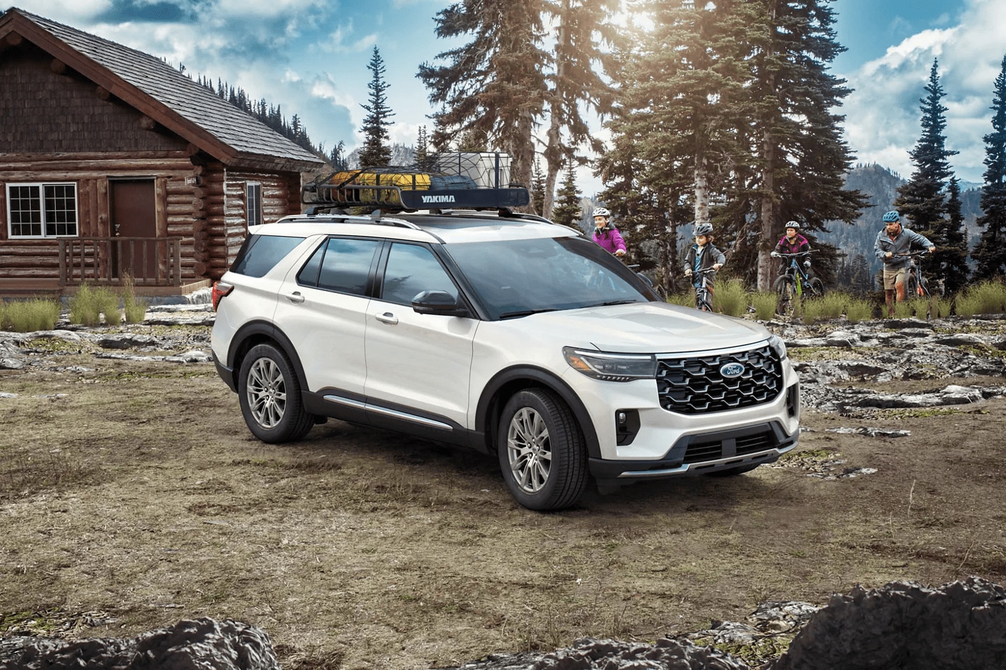 A new Ford vehicle parked at a cabin in wintertime