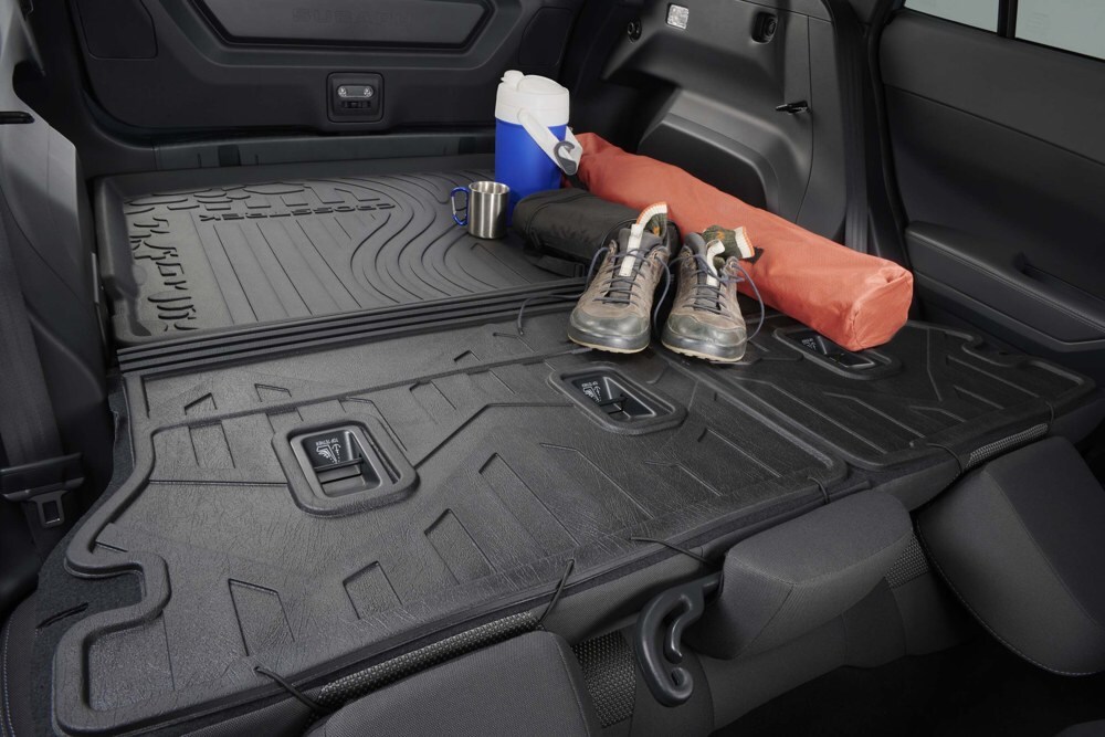 2026 Subaru Crosstrek cargo area with rear seats folded and accessory seatback protectors