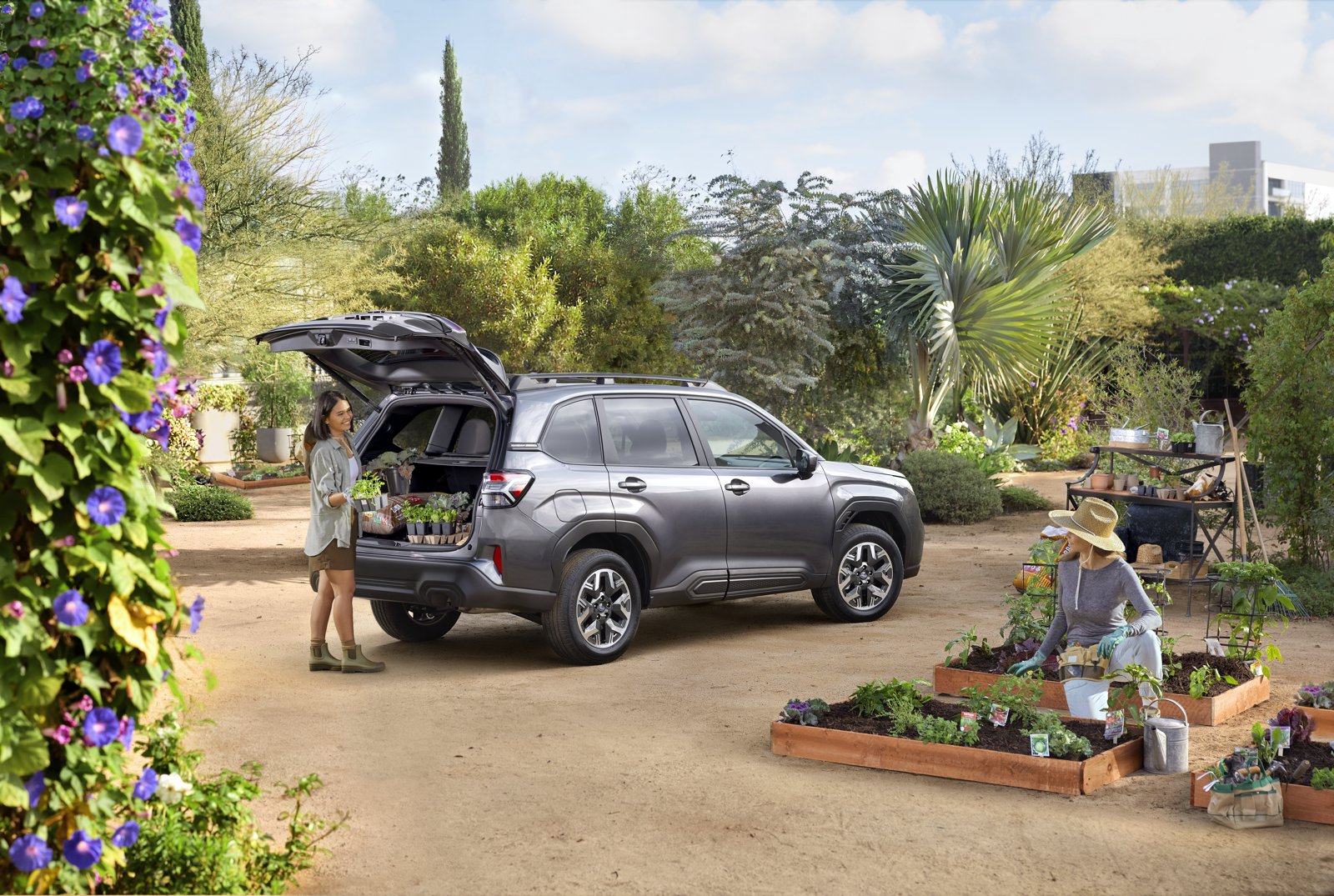 2026 Subaru Forester Premium in Magnetite Gray Pearl with its rear gate open at a garden nursery