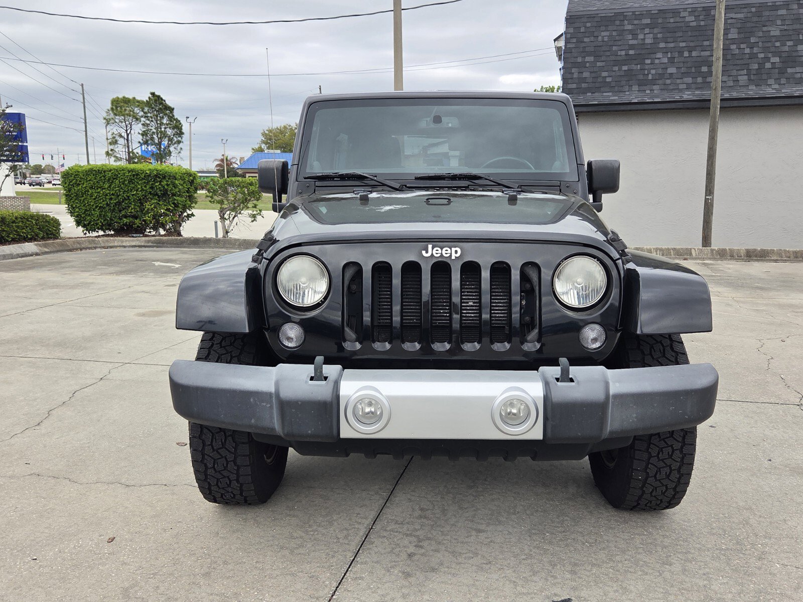 Used 2014 Jeep Wrangler Unlimited Sahara with VIN 1C4BJWEG2EL116742 for sale in Sebring, FL
