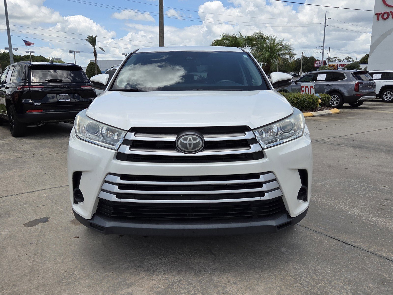 Used 2019 Toyota Highlander LE with VIN 5TDZARFH2KS057161 for sale in Sebring, FL