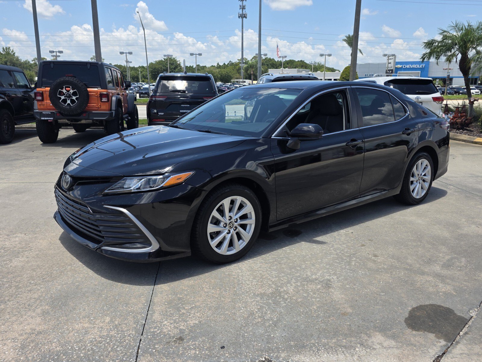 Used 2021 Toyota Camry LE with VIN 4T1C11AK1MU458429 for sale in Sebring, FL