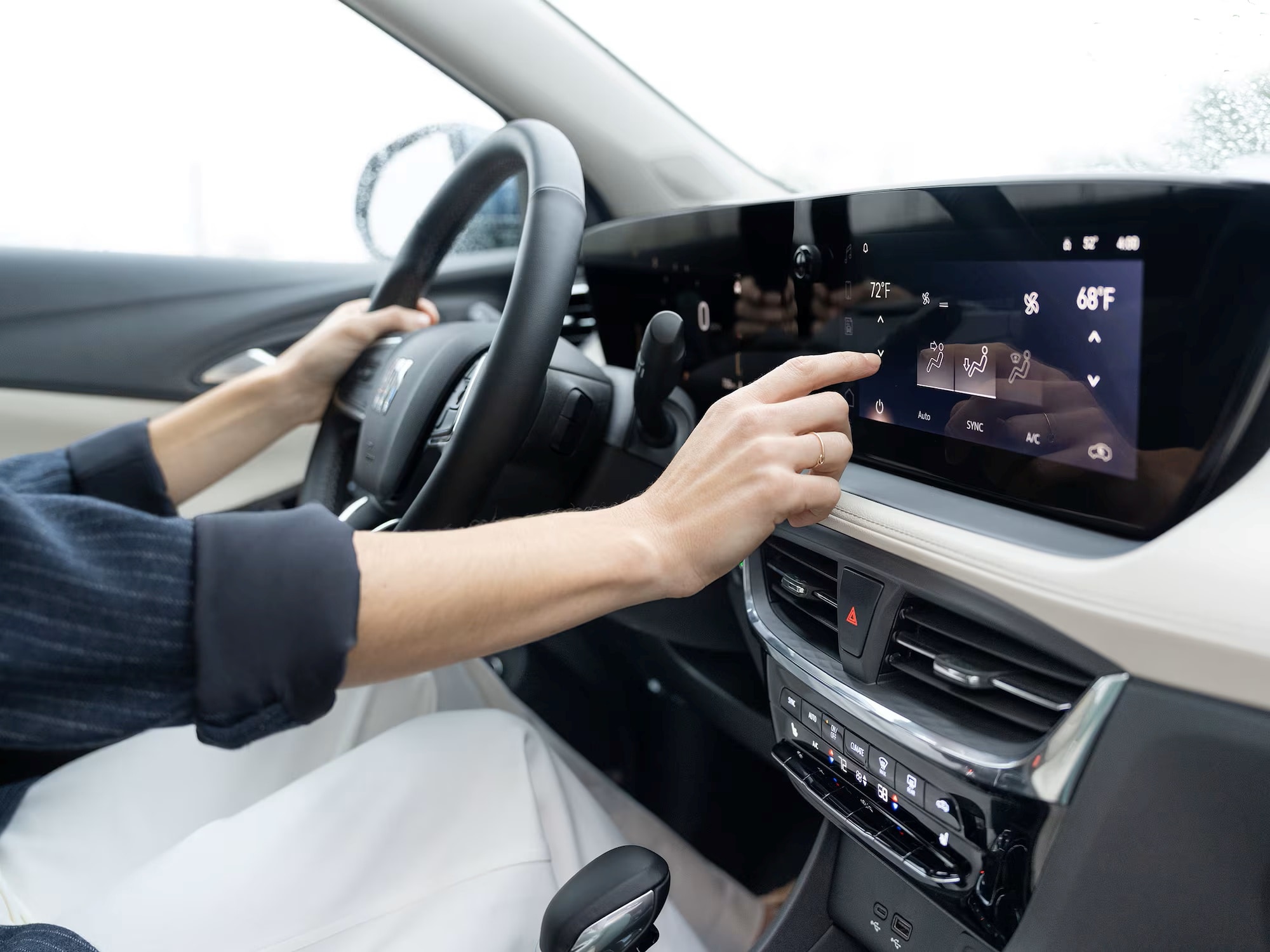 The Driver Using the Infotainment Display in the Buick Encore GX
