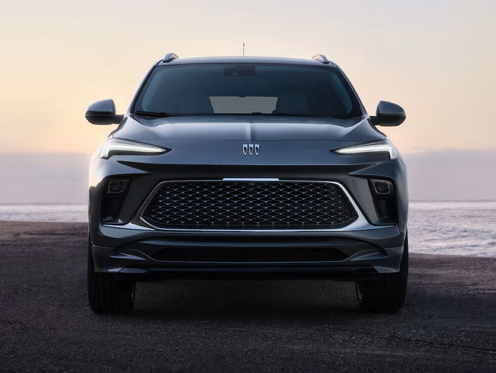 Front View of the 2026 Buick Encore GX Small SUV Parked on the Beach at Sunset