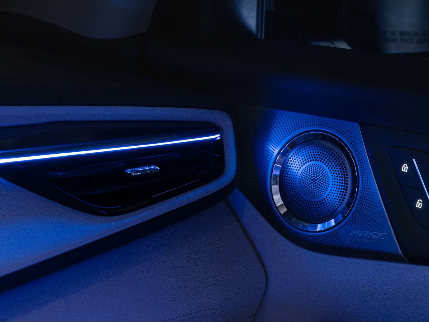 Close-up of the Speaker Attached to the Door Illuminated by Neon Lights inside of a 2026 Buick Enclave