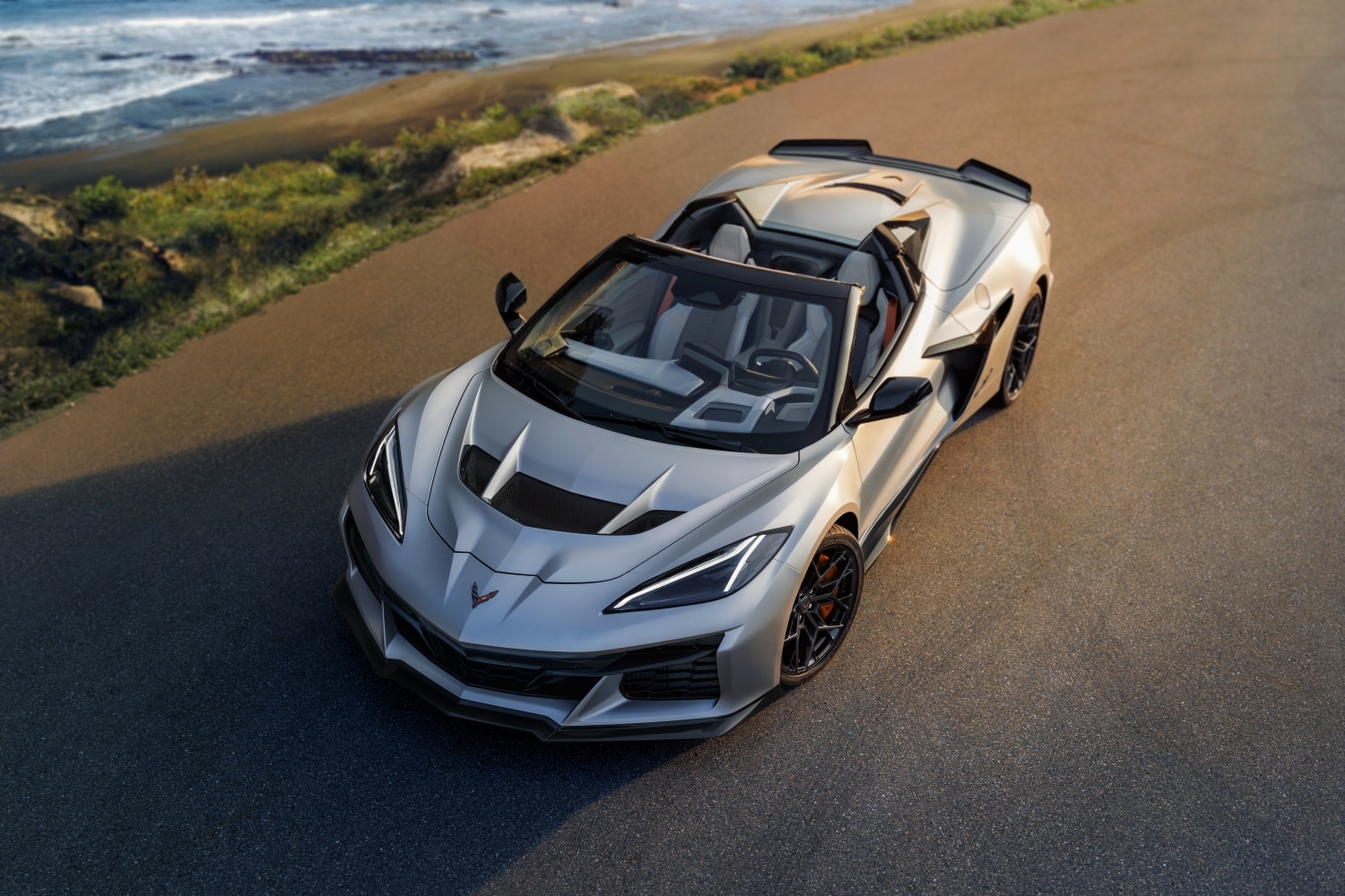 Top-down ZR1X parked near the coast, blending performance with natural beauty | Serra Chevrolet Buick GMC Nashville
