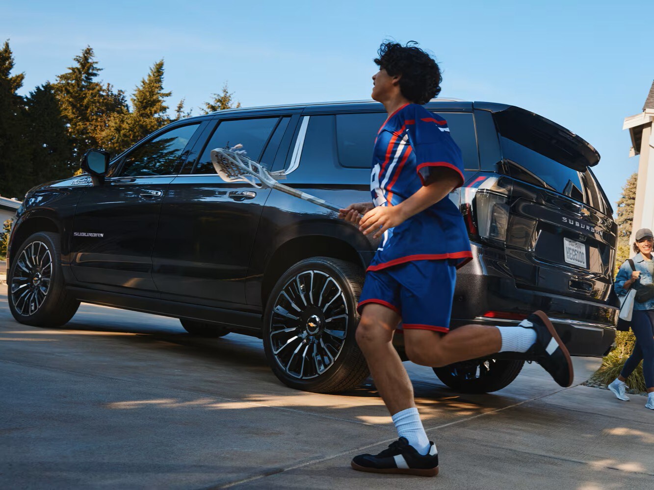  Side profile of 2026 Suburban parked in Clarksville neighborhood