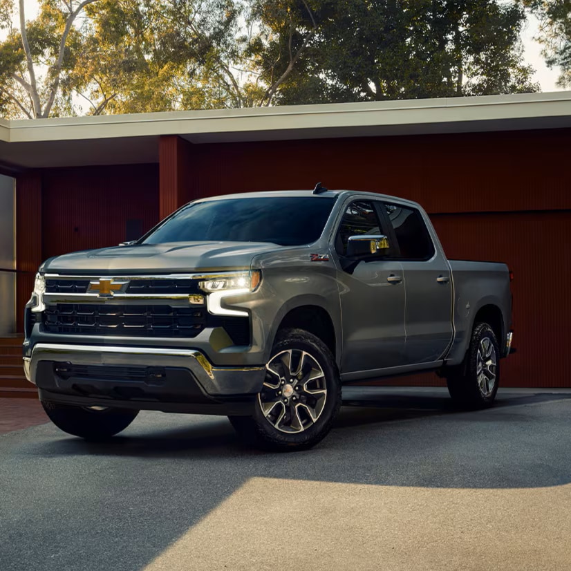 Chevy Silverado LTZ parked outside garage