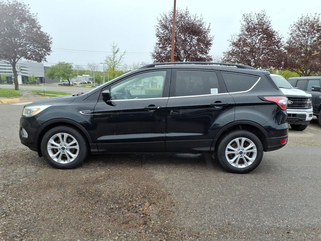 Used 2017 Ford Escape SE with VIN 1FMCU0GD5HUD74937 for sale in Farmington Hills, MI